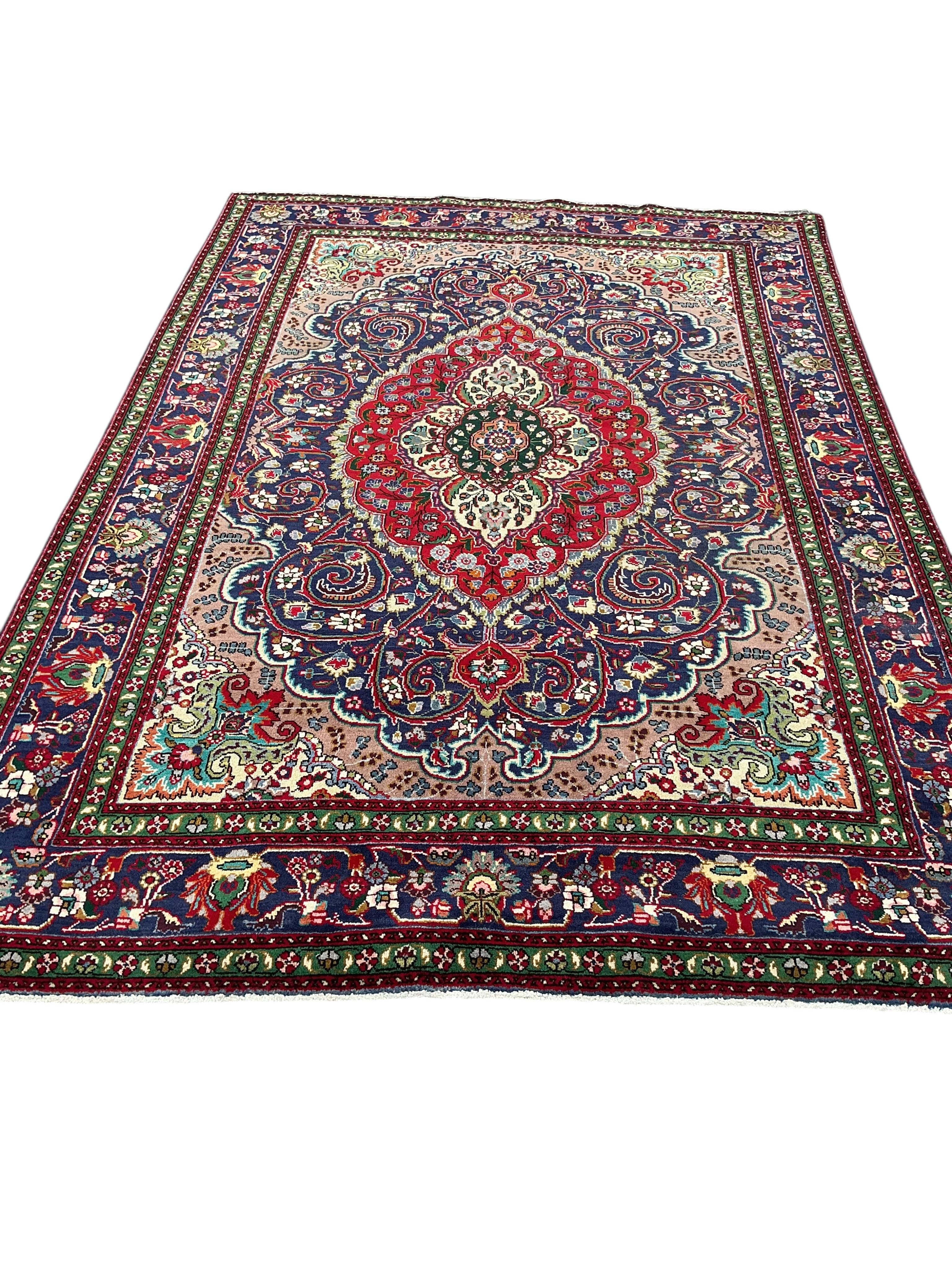 A Tabriz blue ground carpet, 292 x 205cm